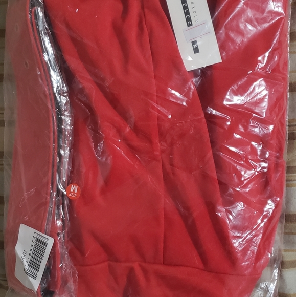 Red jumpsuit still in original package - Picture 2 of 3